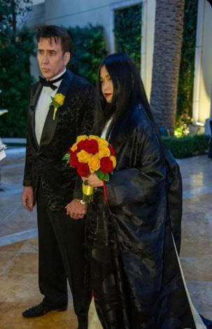 August Coppola son Nicolas Cage with his bride on their wedding day.